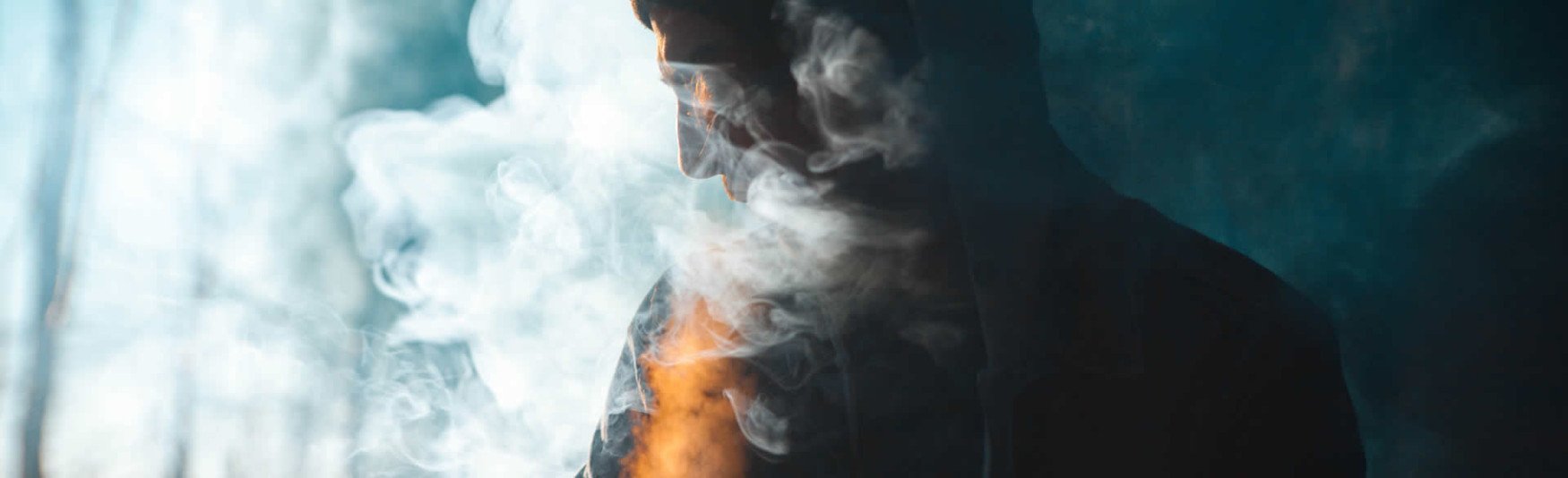 unhealthy person surrounded by cigarette smoke