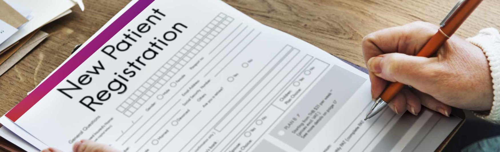 patient filling out registration form